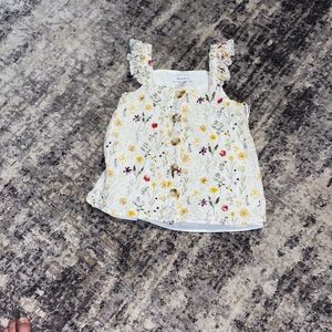 White blouse with different colored flowers